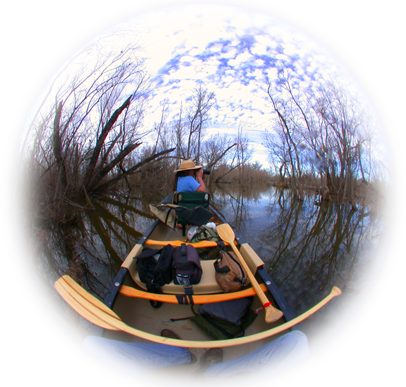 Donna Miller shooting photographs from an Old Town Canoe in Texas waters